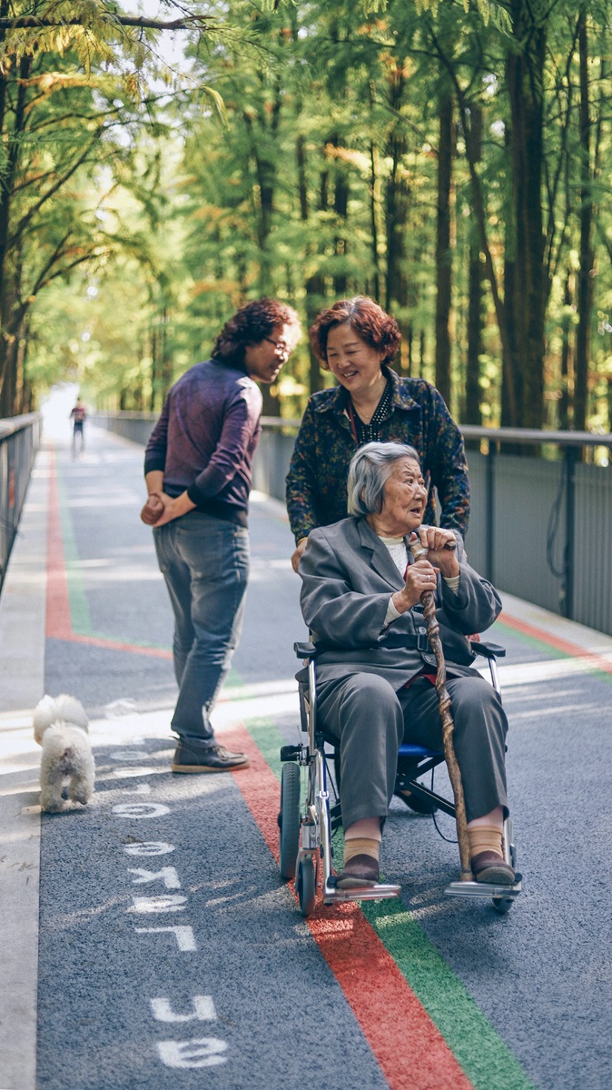 Shows a care worker helping an individual