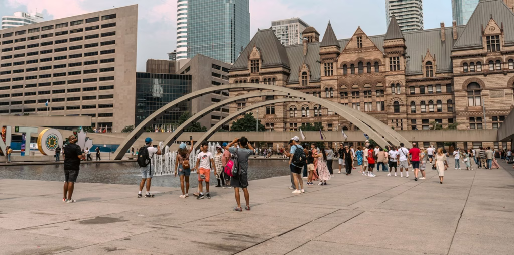A Toronto chiropractor explaining neck pain and tech neck treatment to a patient in a Midtown clinic.